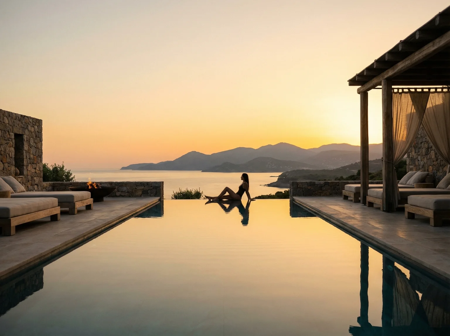 Luxury wellness retreat infinity pool overlooking Mediterranean coastline at sunset with serene spa atmosphere