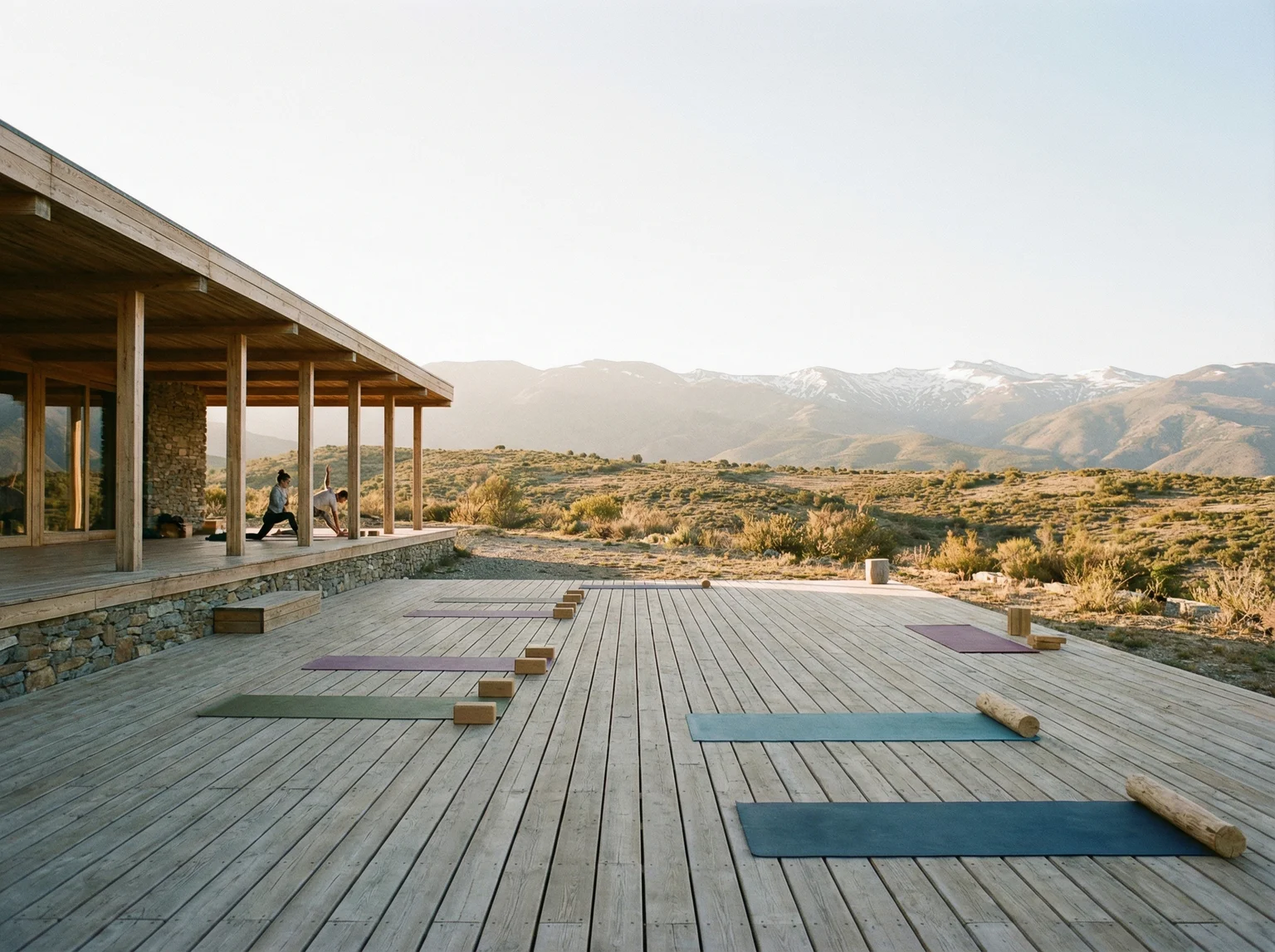Open-air yoga studio with mountain views at a wellness retreat