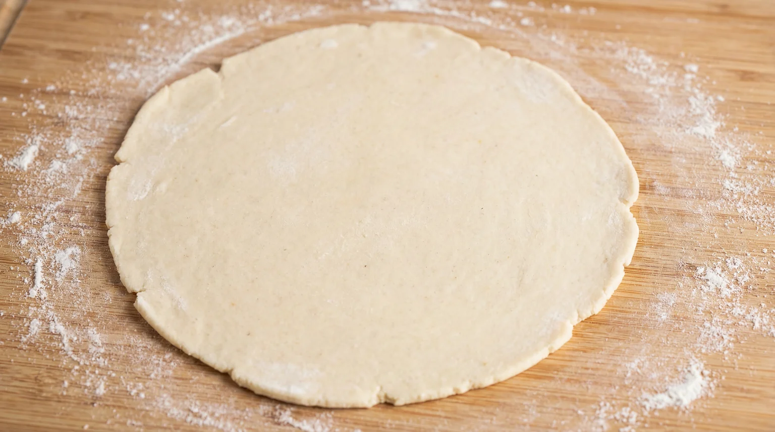 Rolled Tandoori Roti dough—6-inch circle, 2-3mm thick, slightly thicker than chapati for proper stovetop charring